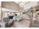Open-concept living space with high ceilings, fireplace, and staircase to the second floor at 2111 Harmony Dr, Canton, GA 30115