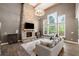 A living room features a stone fireplace, hardwood floors, and a comfortable seating area at 2111 Harmony Dr, Canton, GA 30115