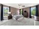 Spacious main bedroom with large windows, ample natural light, and ceiling fan at 2111 Harmony Dr, Canton, GA 30115