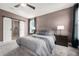 Cozy main bedroom featuring neutral decor, large windows, and en-suite bathroom access at 2111 Harmony Dr, Canton, GA 30115