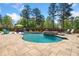 A luxurious in-ground pool with multiple seating areas, perfect for outdoor gatherings at 2111 Harmony Dr, Canton, GA 30115