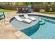 A relaxing outdoor oasis with in-pool loungers and a stone patio for entertaining at 2111 Harmony Dr, Canton, GA 30115