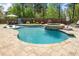 Backyard pool with a tanning ledge, spa, umbrellas and ample room for recreation at 2111 Harmony Dr, Canton, GA 30115