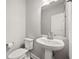 Clean powder room features a stylish pedestal sink, toilet, and modern fixtures at 2111 Harmony Dr, Canton, GA 30115