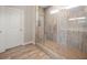 This exquisite shower features decorative stone accents and a glass enclosure at 2111 Harmony Dr, Canton, GA 30115