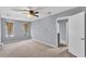 Spacious carpeted bedroom with neutral walls, ceiling fan and a window for natural light at 2998 Kenville Ln, Decatur, GA 30034