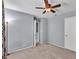 Large bedroom with carpet, soft blue walls, ceiling fan and attached bath at 2998 Kenville Ln, Decatur, GA 30034