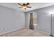 Simple bedroom with carpet, soft blue walls, a window and a ceiling fan for comfort at 2998 Kenville Ln, Decatur, GA 30034