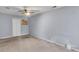Bedroom featuring neutral carpet, soft blue walls, ceiling fan and a closet for ample storage at 2998 Kenville Ln, Decatur, GA 30034