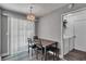 Dining area near a sliding glass door with light fixture overhead at 2998 Kenville Ln, Decatur, GA 30034
