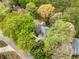 Aerial view of a home with lush trees and a sprawling yard at 3522 Evans Ridge Trl, Atlanta, GA 30340