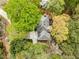 Aerial view of a home with a beautiful lawn surrounded by lush greenery and mature trees at 3522 Evans Ridge Trl, Atlanta, GA 30340