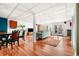 Open basement with hardwood flooring, dining area, and doors leading to the outside at 3522 Evans Ridge Trl, Atlanta, GA 30340