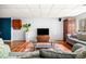 Relaxing basement living area with hardwood floors, a TV, and comfortable sofas, ideal for entertaining at 3522 Evans Ridge Trl, Atlanta, GA 30340