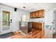 Basement kitchen with stainless steel bar, refrigerator, and access to the outdoor deck and backyard at 3522 Evans Ridge Trl, Atlanta, GA 30340