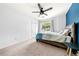 Cozy bedroom featuring a comfortable bed, bright wall accent, and natural light at 3522 Evans Ridge Trl, Atlanta, GA 30340