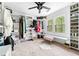 Well-organized walk-in closet with shelving, hanging rods, seating and bright natural lighting at 3522 Evans Ridge Trl, Atlanta, GA 30340