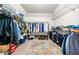 Spacious walk-in closet with ample hanging space, shelving, and storage for shoes and luggage at 3522 Evans Ridge Trl, Atlanta, GA 30340