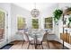 Dining area featuring a built-in bench, decorative lighting, and an abundance of natural light at 3522 Evans Ridge Trl, Atlanta, GA 30340