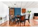 Basement dining area featuring a wood table with seating for five and hardwood flooring at 3522 Evans Ridge Trl, Atlanta, GA 30340