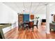 Basement dining area with wood flooring, a round table, and a cozy, inviting ambiance at 3522 Evans Ridge Trl, Atlanta, GA 30340