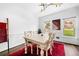 Bright dining room features hardwood floors, modern lighting, and ample seating at 3522 Evans Ridge Trl, Atlanta, GA 30340