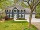 Beautiful home with two-car garage and lush landscaping, enhanced by a meticulously maintained lawn and mature trees at 3522 Evans Ridge Trl, Atlanta, GA 30340