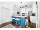 Bright kitchen with white cabinets, stainless steel appliances, a center island, and an eat-in area at 3522 Evans Ridge Trl, Atlanta, GA 30340