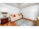 Cozy living room with a sofa, wooden floors, area rug, side table, and a decorative table lamp at 3522 Evans Ridge Trl, Atlanta, GA 30340