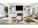 Comfortable living room featuring a stone fireplace and custom built-ins at 3522 Evans Ridge Trl, Atlanta, GA 30340