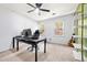 Bright office features a large desk, shelving, and natural light at 3522 Evans Ridge Trl, Atlanta, GA 30340