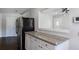 Bright kitchen with granite countertops, white cabinetry and breakfast bar that opens to the living area at 60 Cleveland Se St, Atlanta, GA 30316