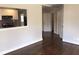 Bright living room area that offers hardwood floors and a kitchen view with a breakfast bar at 60 Cleveland Se St, Atlanta, GA 30316
