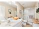 Bright bathroom featuring a vanity, toilet, and glass-enclosed shower, creating a clean and functional space at 981 Golden Meadows Ln, Loganville, GA 30052
