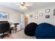 Bedroom featuring two beanbag chairs, a desk, and framed decor, creating a cozy and functional space at 981 Golden Meadows Ln, Loganville, GA 30052