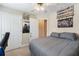 The bedroom shows a gray bed, with closet space and room decor at 981 Golden Meadows Ln, Loganville, GA 30052