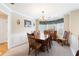 Traditional dining room with a wooden table, chandelier, and bay window offering natural light at 981 Golden Meadows Ln, Loganville, GA 30052