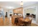Eat-in kitchen featuring breakfast bar and wood table overlooking the living room at 981 Golden Meadows Ln, Loganville, GA 30052