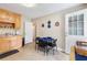 Bright kitchen with wood cabinets, a dining table and rear entry at 981 Golden Meadows Ln, Loganville, GA 30052