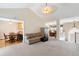 Open-concept living area with seamless access to dining and kitchen spaces at 981 Golden Meadows Ln, Loganville, GA 30052