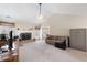 Bright living room with a fireplace, neutral walls, and a cozy seating area at 981 Golden Meadows Ln, Loganville, GA 30052