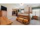 Spacious main bedroom with walk-in closet, vaulted ceiling, four-poster bed, and television at 981 Golden Meadows Ln, Loganville, GA 30052