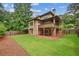 Expansive backyard featuring a well-maintained lawn, wooden deck, and privacy fence at 1155 Mcconnell Dr, Decatur, GA 30033
