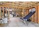 Unfinished basement area with exposed ceiling and plenty of space for recreation or storage at 1155 Mcconnell Dr, Decatur, GA 30033
