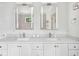 Bathroom featuring double sinks with modern fixtures, ample storage, and bright lighting for a functional design at 1155 Mcconnell Dr, Decatur, GA 30033