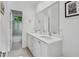 Modern bathroom featuring double sinks, a large mirror, and a separate shower and tub at 1155 Mcconnell Dr, Decatur, GA 30033
