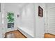 Bright entryway with 3D wall design, bench storage, and outdoor access at 1155 Mcconnell Dr, Decatur, GA 30033