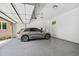 Clean and spacious garage featuring a modern car and epoxy flooring at 1155 Mcconnell Dr, Decatur, GA 30033