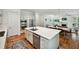 Open concept kitchen with stainless appliances, a large island, and hardwood floors for a modern and inviting feel at 1155 Mcconnell Dr, Decatur, GA 30033