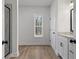 Bathroom showcases glass shower, granite vanity and window for plenty of natural light at 1687 Harmony Rd, Temple, GA 30179